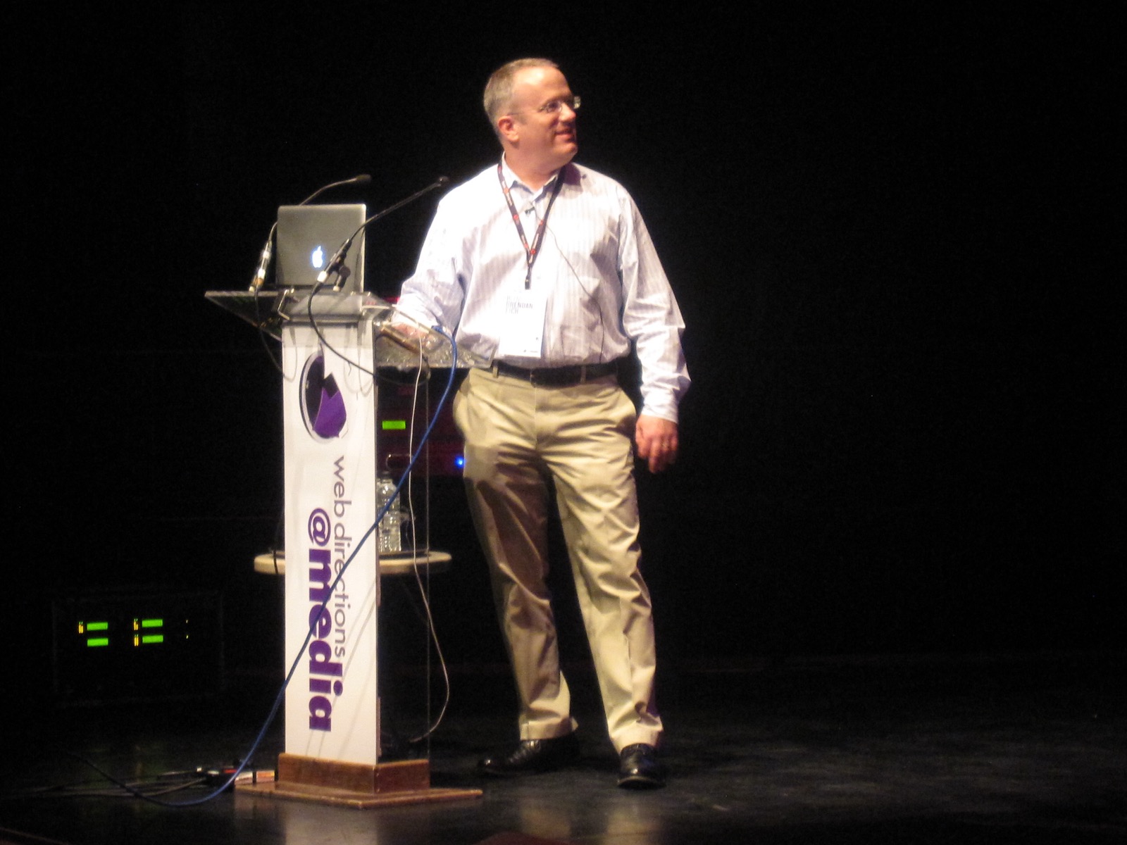 Brendan Eich alone on a dark stage, 2010.