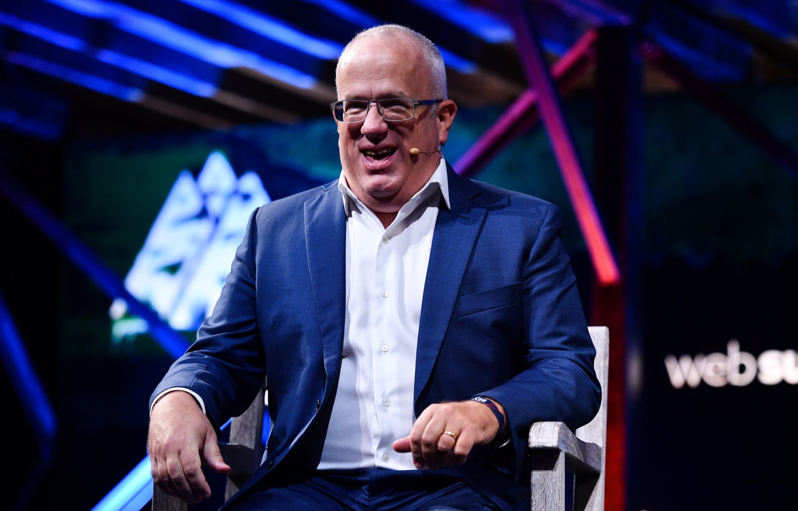 Eich laughing on the Web Summit stage in Lisbon, November 2021. Seven years after the eleven days.