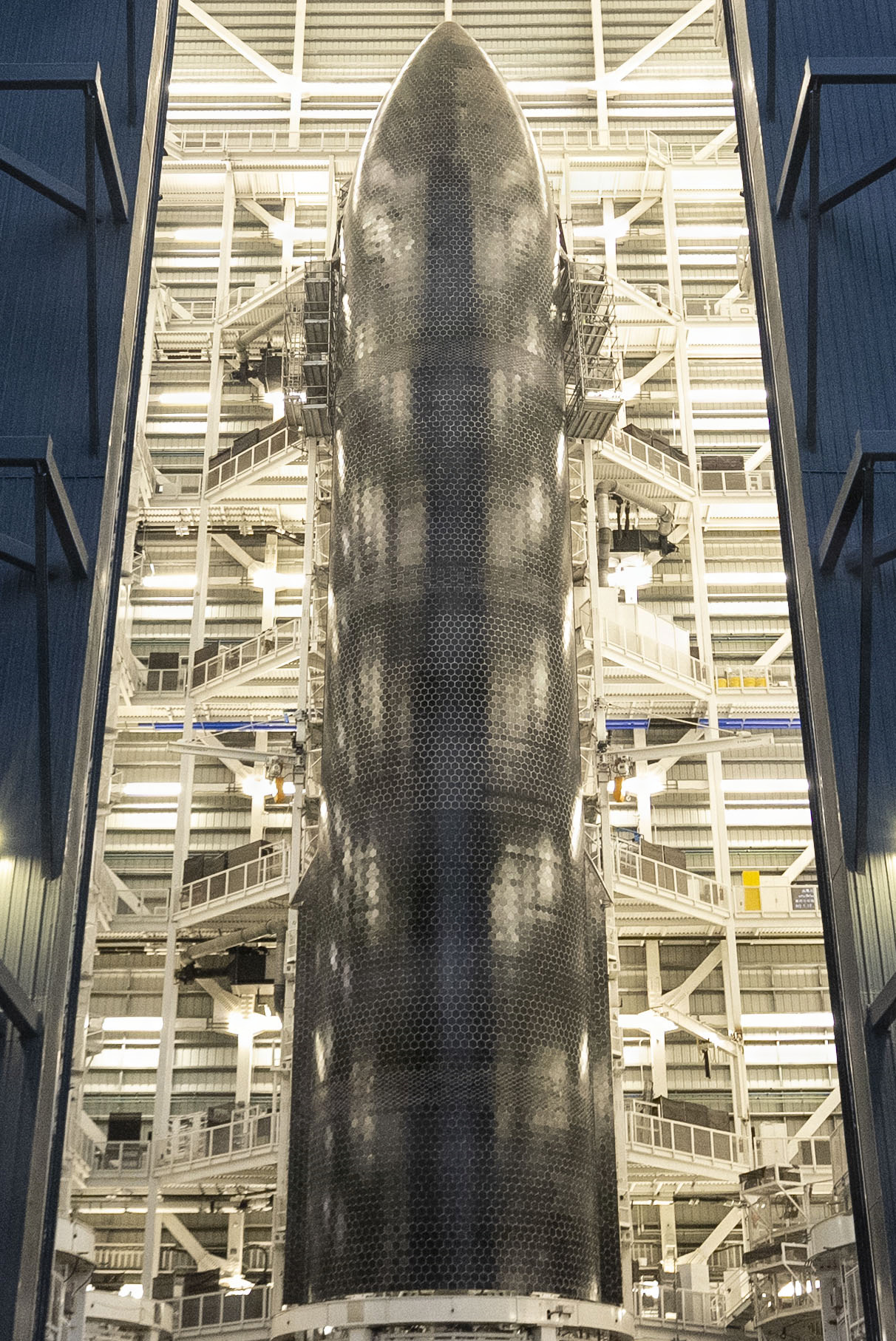 Starship's black hexagonal heat shield tiles on the windward side
