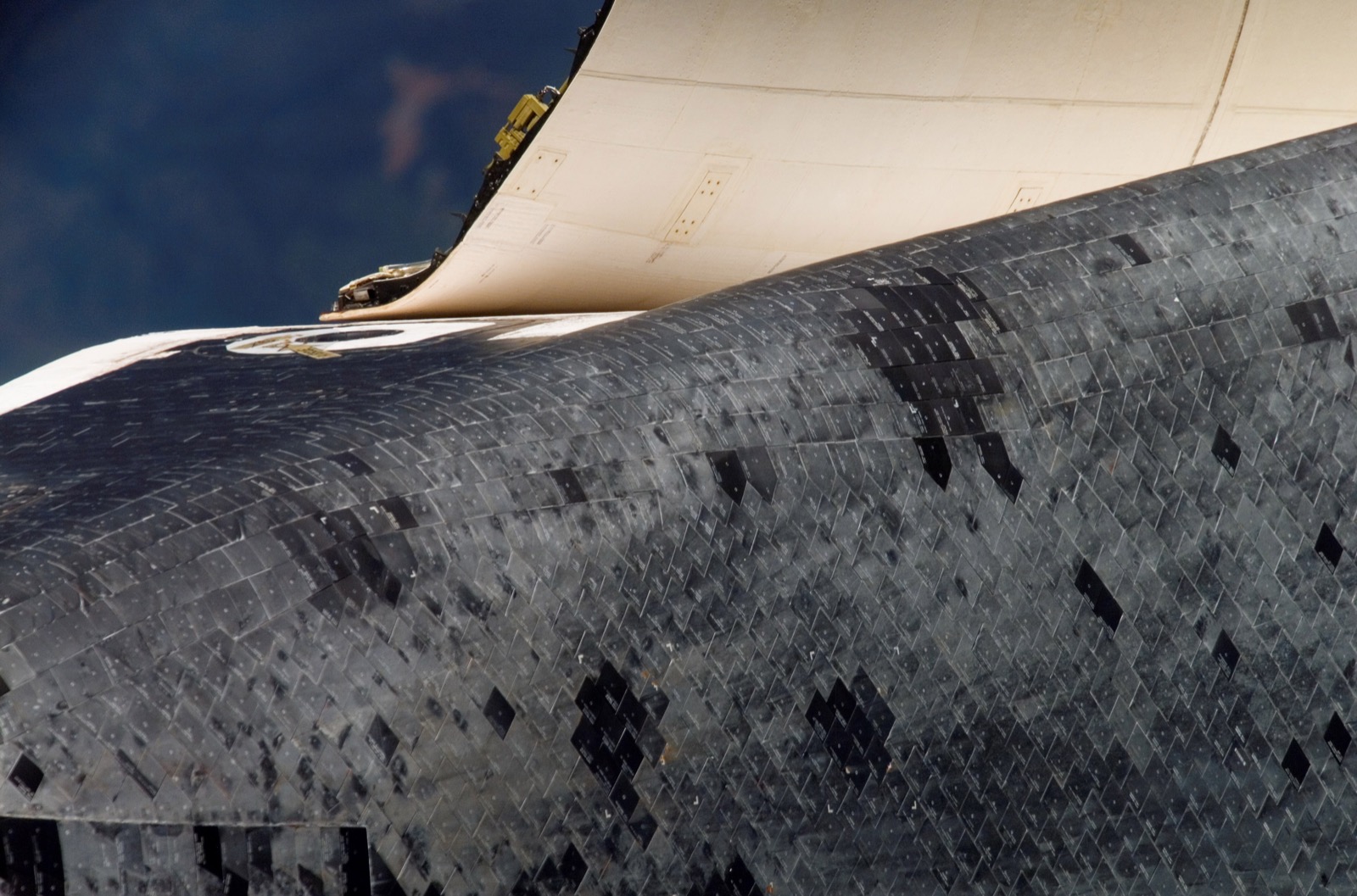 Close-up of the black HRSI tiles on a Space Shuttle orbiter's belly