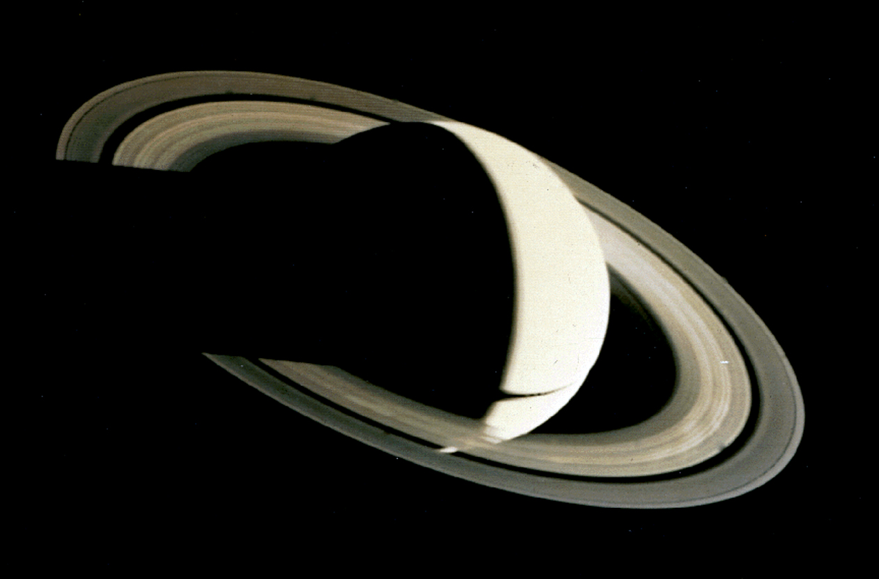 Voyager 1's parting view of Saturn, a crescent with its rings, taken after the 1980 flyby.