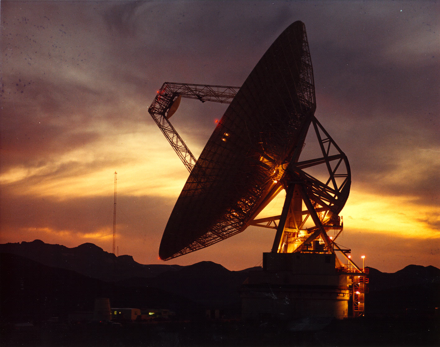 A 70-meter Deep Space Network antenna at Goldstone, California, at sunset.