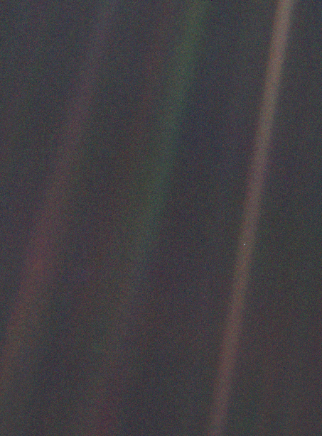 The Pale Blue Dot: Earth as a single pixel in a sunbeam, photographed by Voyager 1 in 1990.