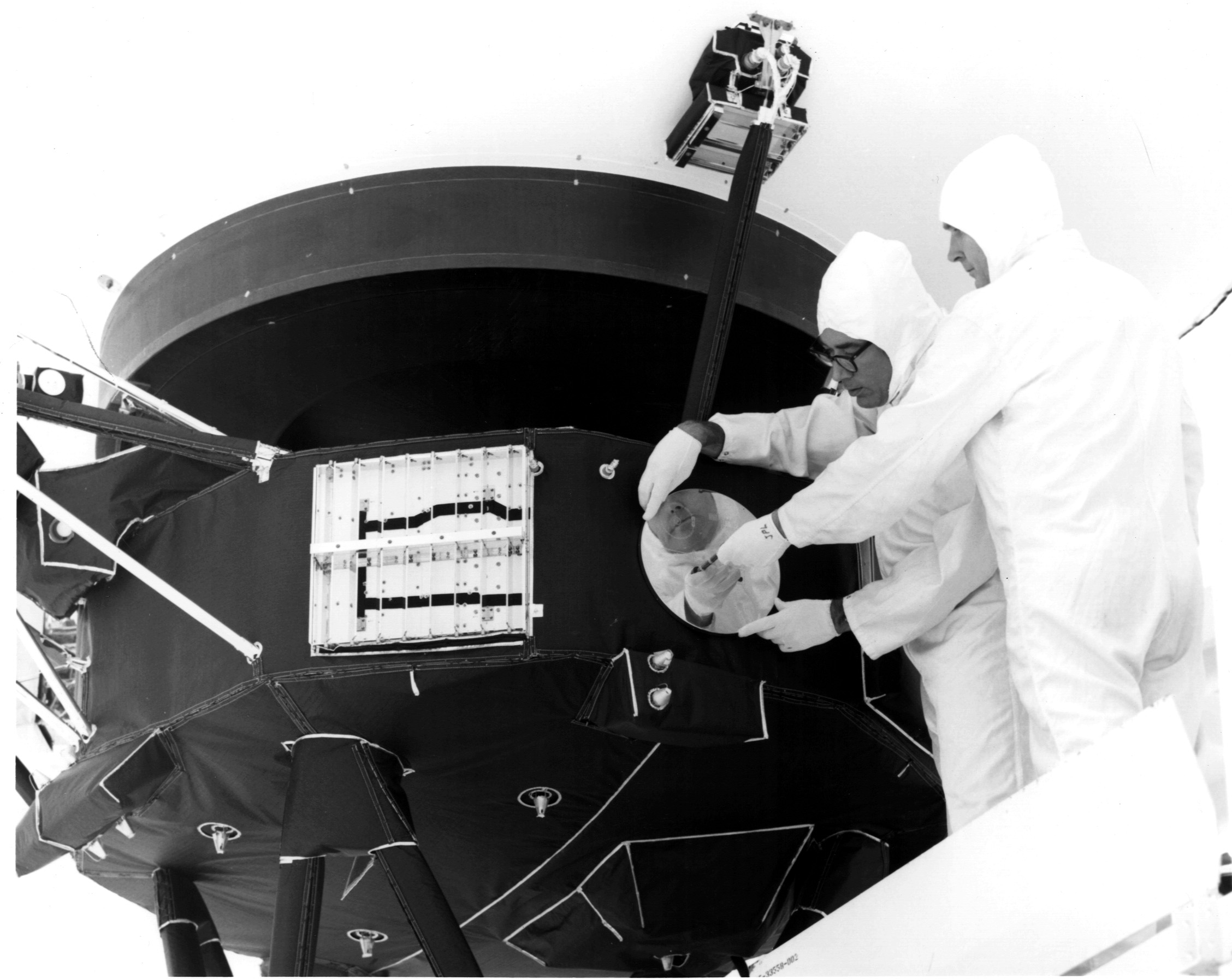 The gold-plated Golden Record being mounted onto Voyager before launch.