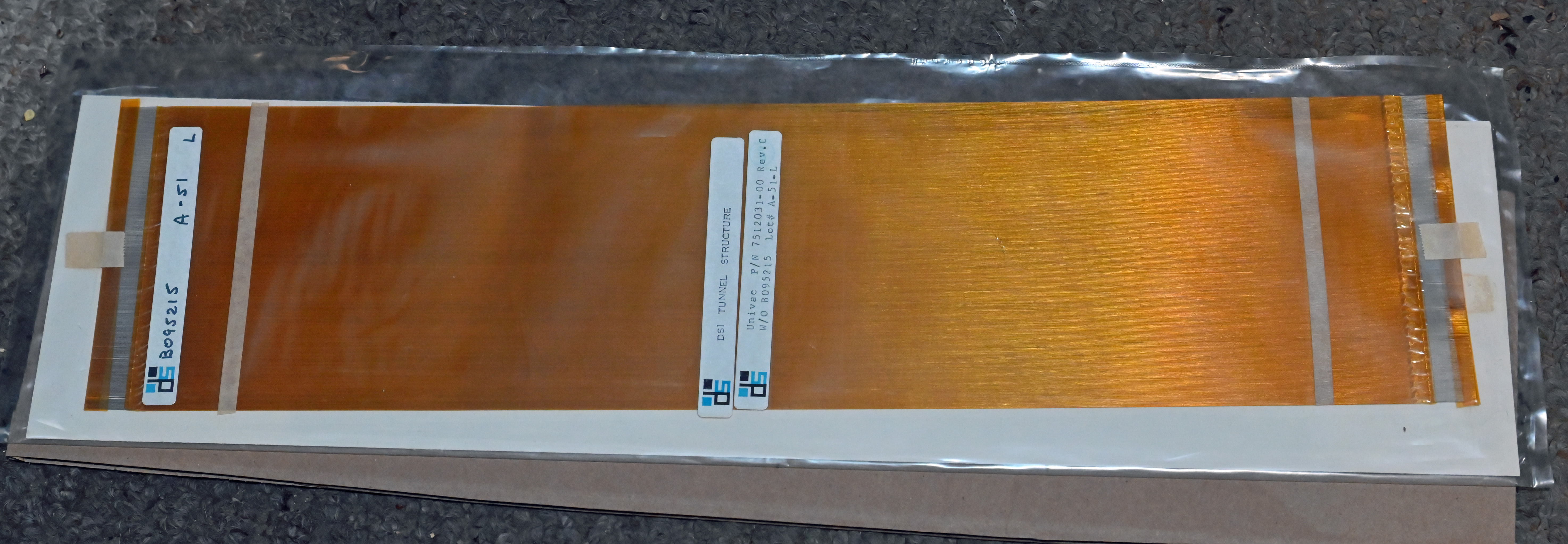 A plated-wire memory data plane, showing the fine wires that store data magnetically.