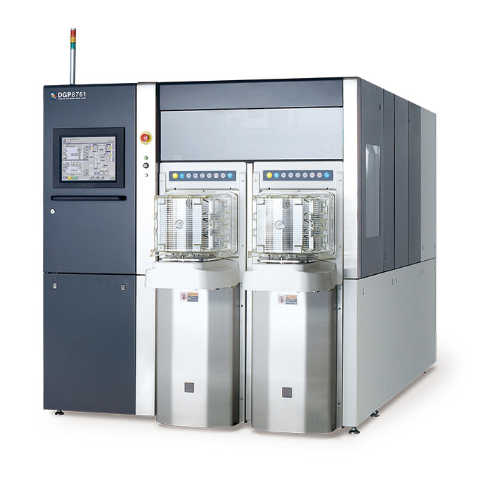 A DISCO DGP8761 wafer grinder/polisher — a room-sized machine with twin processing chambers and a control touchscreen — used to thin silicon wafers to a few tens of micrometers.