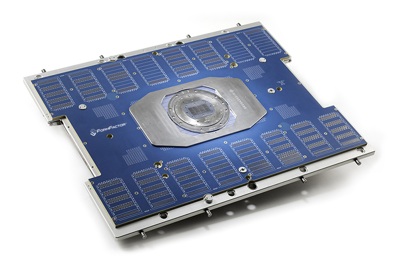 A FormFactor Apollo vertical probe card: a large blue printed-circuit frame with a metal probe head at its center, where thousands of microscopic MEMS springs touch down on the chip under test.