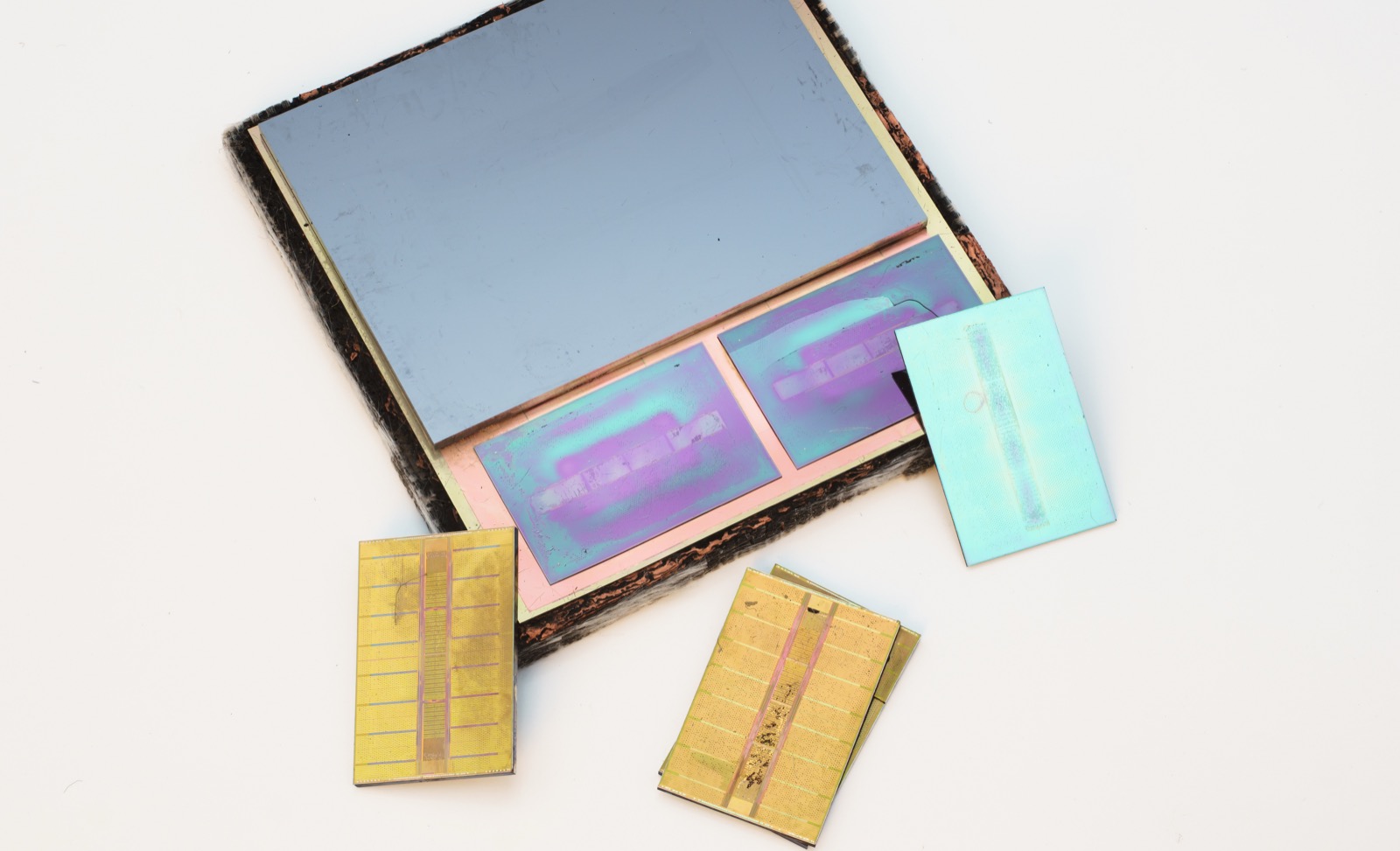 The HBM2 interposer of an AMD Radeon RX Vega 64, with the memory stacks removed — exposing the dense field of micro-pads that the HBM dies bond to, just beside the GPU.