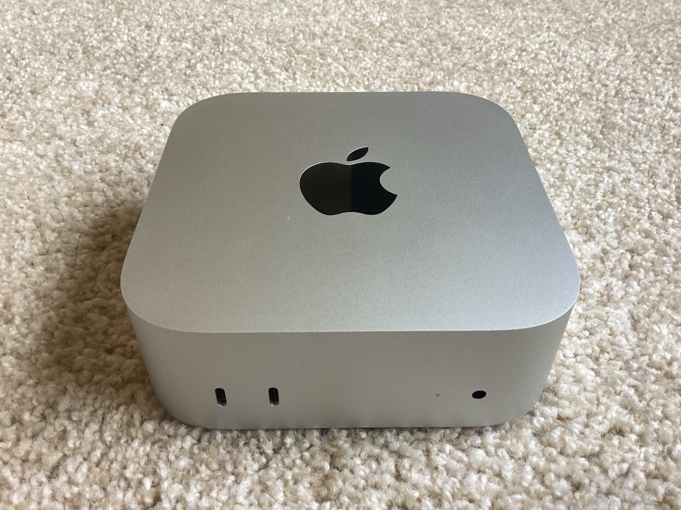 A Mac Mini—the kind of small, already-paid-for silicon that can run a world model's continuous simulation loop at zero marginal cost. The hardware exists. It's sitting on desks right now.