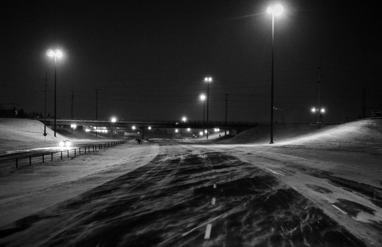 An empty Calgary road in a night blizzard